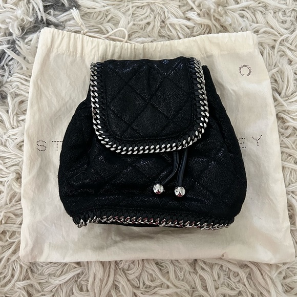falabella mini backpack Stella McCartney purple shaggy deer W9477 The Falabella backpack features a quilted vegan body Stella McCartney Black Faux Suede